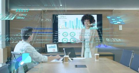 Businesswoman presenting data in modern boardroom with digital overlay