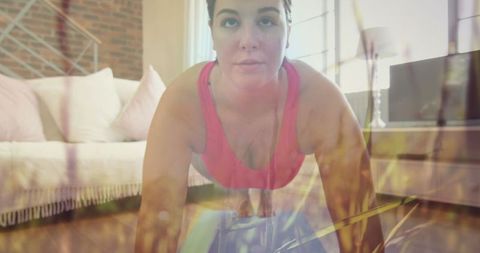 Caucasian woman performing plank exercise blending with meadow scenery