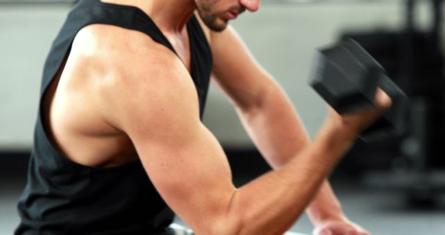 Focused Man Lifting Dumbbells in Gym for Strength Training - Download Free Stock Images Pikwizard.com