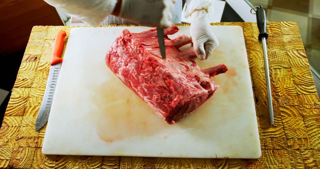 Butcher Cutting Raw Beef Rib Eye on Wooden Board - Download Free Stock Images Pikwizard.com