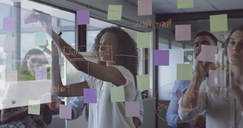 Diverse Team Brainstorming Ideas with Creative Sticky Notes