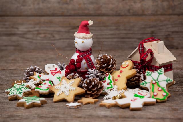 Festive Christmas Cookies with Snowman and Pine Cones - Download Free Stock Photos Pikwizard.com