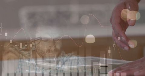 Businessman Analyzing Financial Data on Tablet with Overlaid Graphs