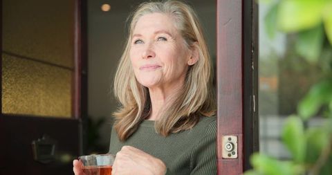 Senior Woman with Cup of Tea Enjoying Peaceful Morning