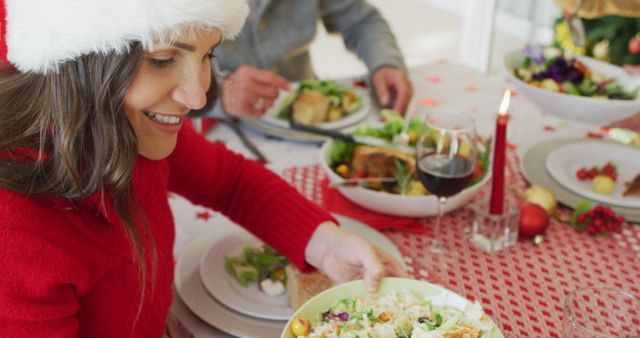 Woman Enjoying Christmas Dinner with Friends and Family - Download Free Stock Images Pikwizard.com