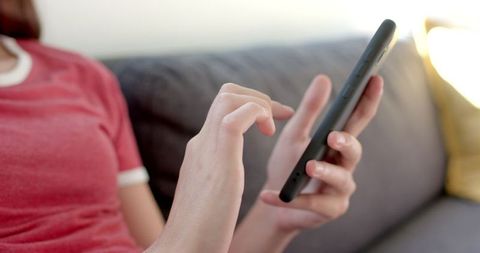 Teenage Girl Engaged with Smartphone at Home in Close-Up - Download Free Stock Images Pikwizard.com