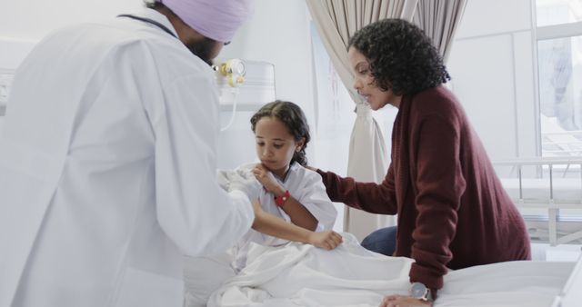 Doctor Examining Young Girl in Hospital with Concerned Mother - Download Free Stock Images Pikwizard.com