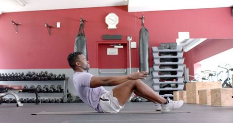 Fit African American Man Performing Core Exercises at Gym in Slow Motion - Download Free Stock Images Pikwizard.com