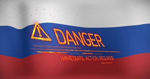 Danger sign on russian flag symbolizing conflict
