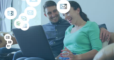 Couple Managing Emails on Laptop with Digital Overlays