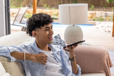 Young Man Enjoying Leisurely Moment Communicating on Phone