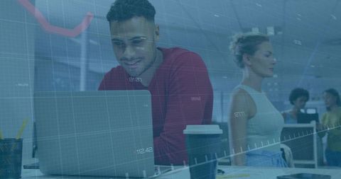 Professional Analyzing Data Visualizations on Laptop in Modern Workplace