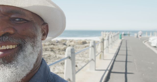 Cheerful Senior Man Enjoying Sunny Day on Oceanside Boardwalk - Download Free Stock Images Pikwizard.com