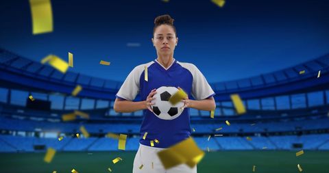Focused Female Soccer Player Holding Ball in Stadium with Celebratory Confetti - Download Free Stock Images Pikwizard.com