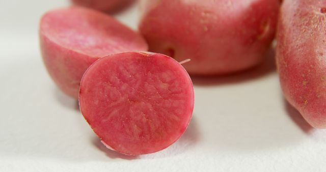 Close-up of Fresh Cut Red Potatoes on White Surface - Download Free Stock Images Pikwizard.com