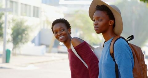 African American Twin Sisters Exploring Urban Cityscape