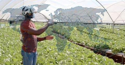 Farmer Using VR Technology in Greenhouse for Precision Agriculture
