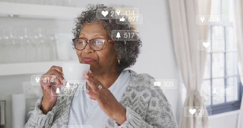 Senior woman relaxing with hot drink in cozy kitchen