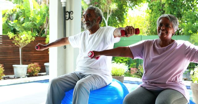 Senior couple exercising together using dumbbells and a stability ball in a backyard. Suitable for promoting health and wellness for older adults, outdoor fitness, active senior lifestyles, and physical well-being related content.