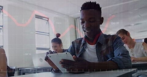 Diverse Students Engaging with Tablets and Laptops in Tech-Focused Classroom