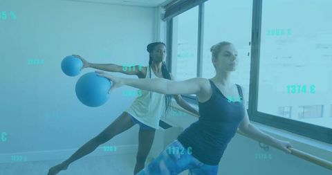 Women performing barre exercises with stability balls in modern studio