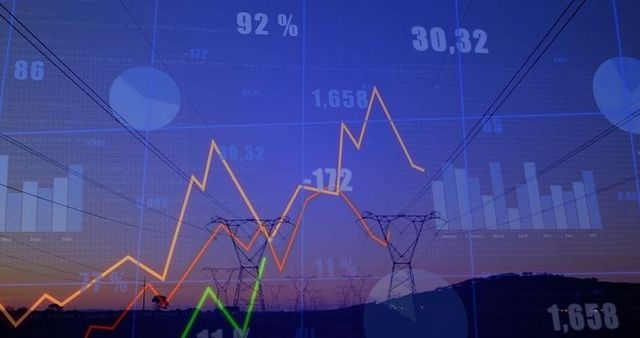 Transmission towers with financial data overlay during dusk