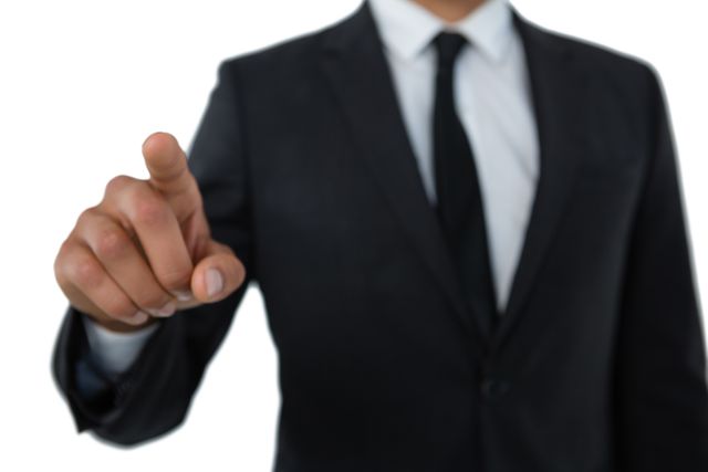 Businessman in formal suit pointing finger, symbolizing decision-making, leadership, and authority. Useful for business presentations, corporate websites, leadership articles, and professional training materials.