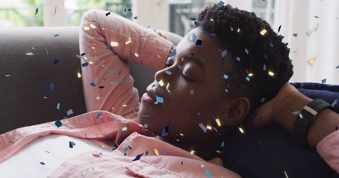 Celebratory Confetti Falling on Sleeping Woman