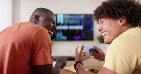 Diverse Friends Enjoying Multiplayer Video Gaming Session