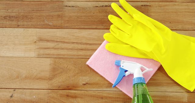 Cleaning Supplies on Wooden Floor with Rubber Gloves and Spray Bottle - Download Free Stock Images Pikwizard.com