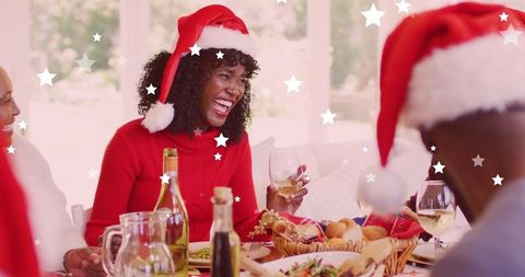 Cheerful African American Family Celebrating Christmas Dinner with Santa Hats - Download Free Stock Images Pikwizard.com