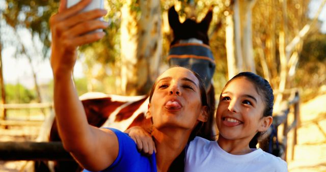 Playful Mother and Daughter Taking Selfie at Farm - Download Free Stock Images Pikwizard.com