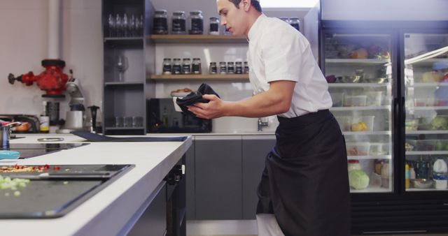 Chef Preparing Ingredients in Modern Commercial Kitchen - Download Free Stock Images Pikwizard.com