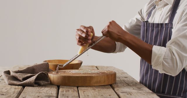 Chef Grating Cheese Over Wooden Cutting Board - Download Free Stock Images Pikwizard.com