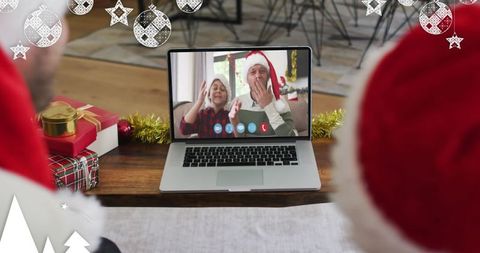 Family Video Call during Christmas Celebration with Santa Hats