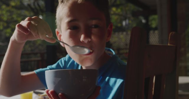 Young Boy Eating Breakfast Outdoors During Morning - Download Free Stock Images Pikwizard.com