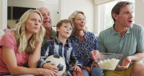 Excited Family Cheering Together at Home
