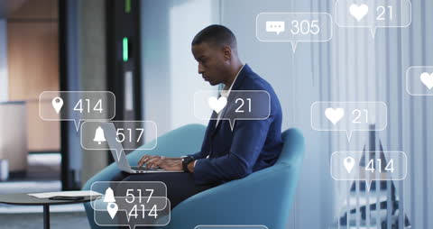 Man Working on Laptop Surrounded by Digital Notifications