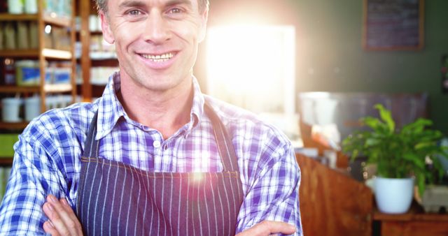 Cheerful Male Barista Smiling in Coffee Shop - Download Free Stock Images Pikwizard.com