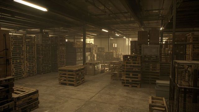Stacking wooden pallets and crates inside dusty industrial warehouse with concrete floor