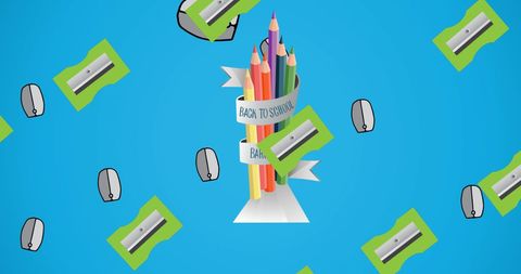 Colorful pencils and supplies on blue for back to school