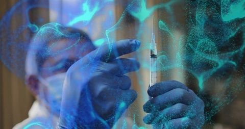 Medical professional steadying syringe and drawing vaccine under blue digital overlay