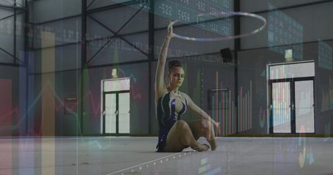 Teenage Gymnast Training With Hoop in Sports Hall