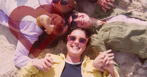 Joyful Women Relaxing Together on Sunny Beach Paradise