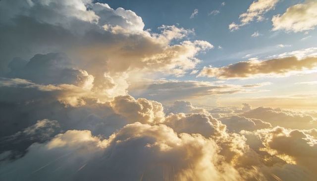 Golden Sunlit Cloudscape Drifting Above Stratocumulus Tops with Dramatic Sunbeams
