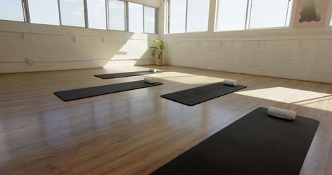 Sunlit Yoga Studio with Mats and Towels Ready for Session - Download Free Stock Images Pikwizard.com