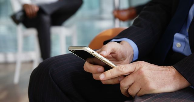 Businessperson Texting on Smartphone in Office Waiting Room - Download Free Stock Images Pikwizard.com