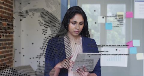 Businesswoman Using Tablet in Office with Global Data Overlay