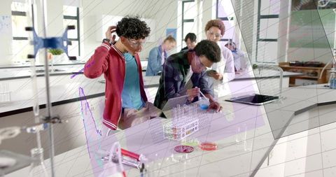 Students conducting chemistry experiment pipetting blue solution in collaborative lab