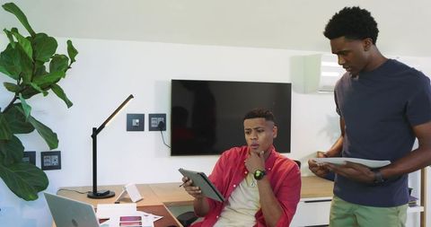 Diverse Professionals Collaborating on Digital Presentation